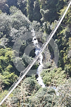 Bridge over a river in the mountains of Nepal`s Langtang National Park