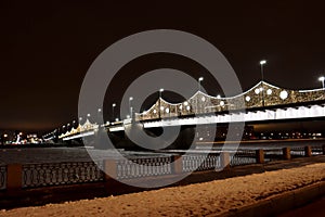 Bridge over the river at night with beautiful christmas new year illumination