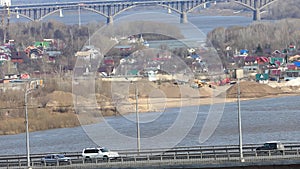 Bridge over the river, traffic on the bridge and extraction of river sand. Video.