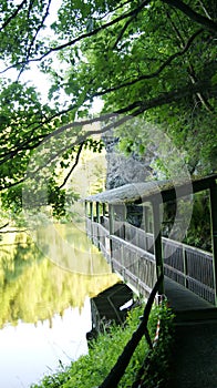 A bridge over the river, but under a rock.