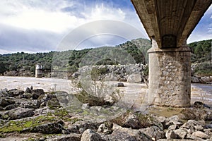 Bridge over the river yeguas near the central hydroelectric reservoir of Encinarejo