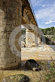 Bridge over the river yeguas near the central hydroelectric reservoir of Encinarejo