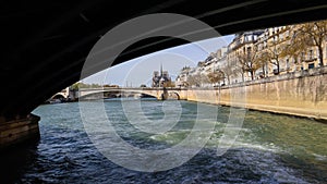 The bridge over Seine river frames Notre Dame Cathedral. Before the fire. April 05, 2019. Paris France