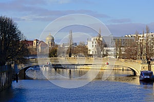 Bridge over Spree river with cupola of New Synagogue behind