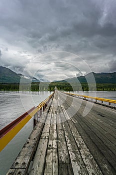 Bridge over Susitna river under the clouds photo