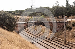 Bridge, over the train track in the countryside photo