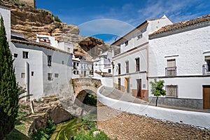 Bridge over Trejo River and rock overhangs - Setenil de las Bodegas, Andalusia, Spain photo