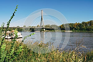 Bridge over the Vistula river in Warsaw, Poland, in a bright sunny day