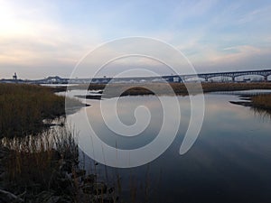 Bridge over Wetlands and Hackensack River during Sunset in Jersey City, NJ.