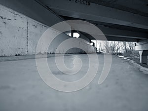 Bridge overpassing walking trail in a park photo