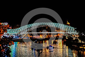 The Bridge of Peace is a bow-shaped pedestrian bridge, a steel and glass construction illuminated with LEDs, in Tbilisi