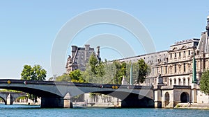 Bridge pont du Carrousel of Seine river and Louvre museum