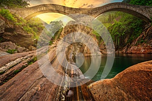 The romanic historic bridge Ponte Dei Salti Bridge in Lavertezzo, Verzasca Valley, ticino, Switzerland. Travel concept.