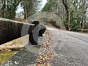 Bridge rail view an old gravel country road