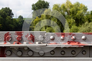 Bridge railing connected with bolt, nut and rivet painted with primer paint