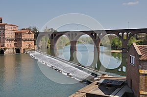 A bridge is reflected in the river