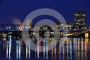 Bridge Reflecting On A Calm River