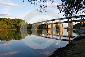 Bridge reflection over waters of Danube river