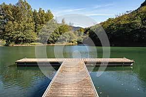 Dock in Reservoir of Valdemurio, Senda del Oso, Asturias, Spain photo