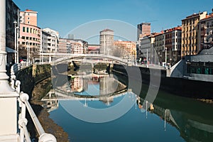 Bridge of the Ribera de Bilbao on a sunny day photo