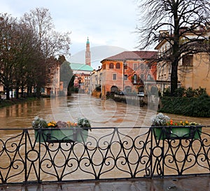 Bridge and river called FIUME RETRONE in Vicenza City in Italy during flood