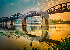 The bridge on the river Kwai at sunrise. Railway in Kanchanaburi, Thailand