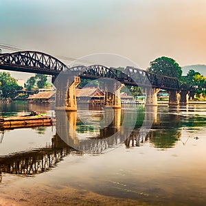 The bridge on the river Kwai at sunrise. Railway in Kanchanaburi, Thailand