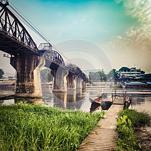 The bridge on the river Kwai at sunrise. Railway in Kanchanaburi, Thailand