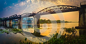 The bridge on the river Kwai at sunrise. Railway in Kanchanaburi, Thailand. Panorama