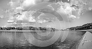 Bridge on river Nemunas in Kaunas city on sunny cloudy evening in summer