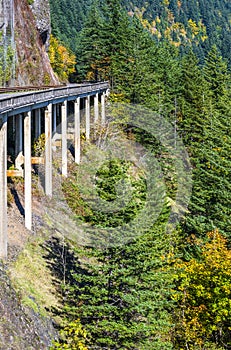 The bridge with the road around the cliff on one side and the abyss of the other side in Columbia Gorge