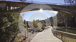 Bridge and road, autumn day and shining sun