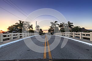 Bridge roadway over a riverway that leads to the ocean on Marco Island