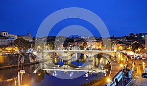 Bridge from Rome and its reflection in river Tiber