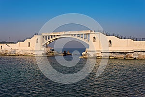 Bridge in the sea at Montazah park with calm sea at sunrise time, Alexandria, Egypt