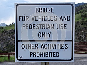 A bridge sign prohibiting any activity