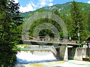 Bridge and a small hydroelectric power plant at Triglavska Bistrica river near Mojstrana, Slovenia photo