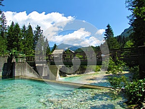 Bridge and a small hydroelectric power plant at Triglavska Bistrica river near Mojstrana, Slovenia photo