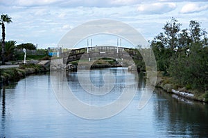 A bridge spans a river, with a view of the water below