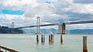 Bridge structure architecture over sea water under cloudy sky in San Francisco, USA