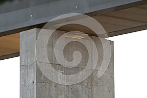 Bridge structure from underneath with background forest