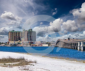 Bridge to Destin and city hotels under a sunset winter sky, Florida