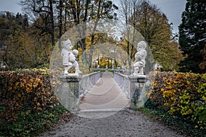 Bridge to Dwarf Garden Zwergerlgarten with Pallone Player Dwarfs  - 17th century statues - Salzburg, Austria