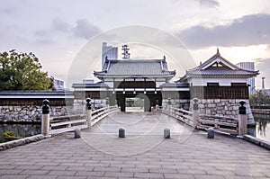 The bridge to entrance at hiroshima castle with wall to protect