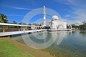 Bridge to floating mosque of Tengku Tengah Zaharah located at Kuala Ibai Lagoon, the estuary river at Kuala Terengganu, Malaysia photo