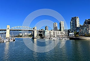 Bridge to greenville and water bus passing under the bridge Nature Canada Vancouver Pacific Ocean Pier and pillars on