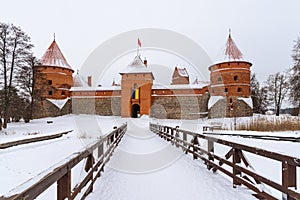 Bridge to the historical Trakai stone castle in winter, front view, Lithuania.
