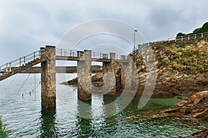 Bridge to the lighthouse in the Bay of Biscay photo