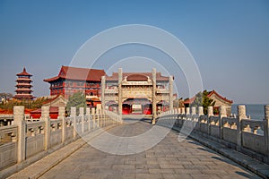 The bridge to the Penglai pavilion during the sunset, Yantai, Shandong, China. Copy space for text, blue sky