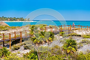 The bridge to the sandy beach Playa Paradise of the island of Cayo Largo, Cuba. Copy space for text.